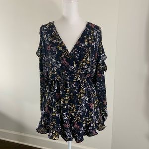 Size medium navy blue Lush romper with flower designs